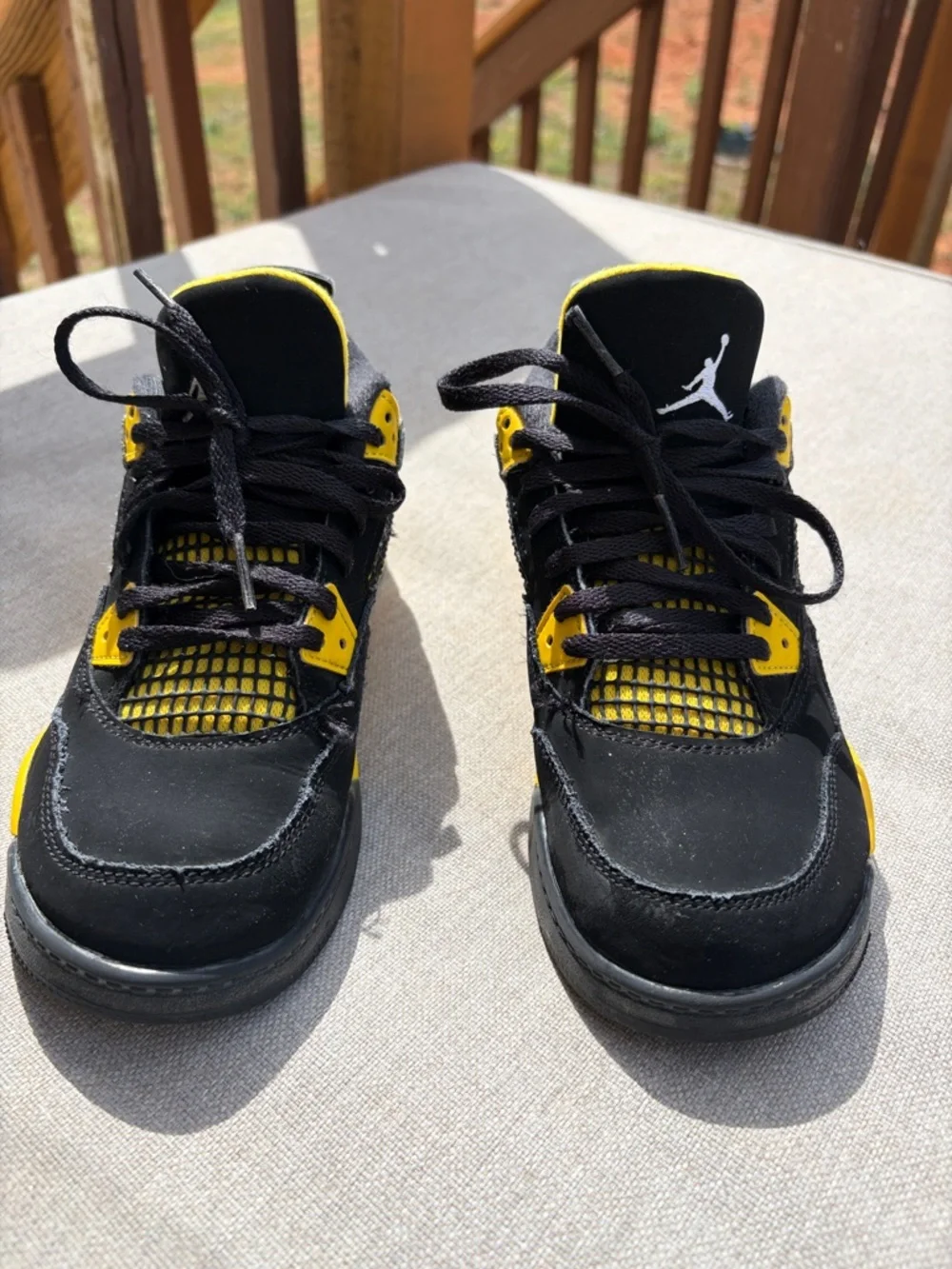 Air Jordan 4 Retro “Thunder” in size 2.5Y GUC.